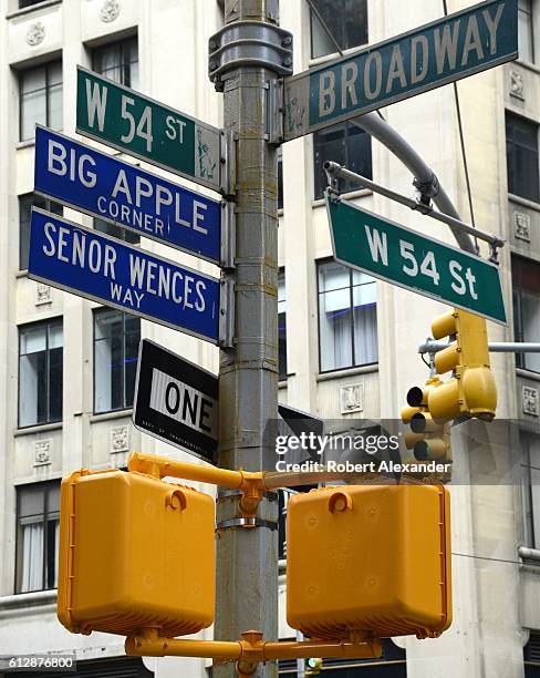 September 6, 2016: Street signs at the corner of Broadway and 54th Street in New York City identify the streets' official and honorary names. Senor...