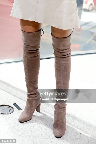 Padma Lakshmi, boot detail, visits "Extra" at their New York studios at H&M in Times Square on October 5, 2016 in New York City.