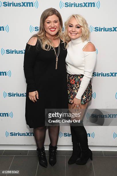Singer Kelly Clarkson poses with singer RaeLynn at SiriusXM Studios on October 5, 2016 in New York City.