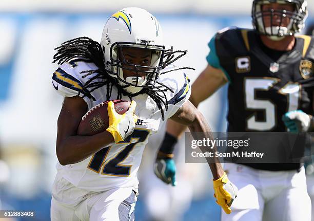 Travis Benjamin of the San Diego Chargers eludes Paul Posluszny of the Jacksonville Jaguars on a pass play during a game at Qualcomm Stadium on...