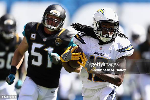 Travis Benjamin of the San Diego Chargers eludes Paul Posluszny of the Jacksonville Jaguars on a pass play during a game at Qualcomm Stadium on...