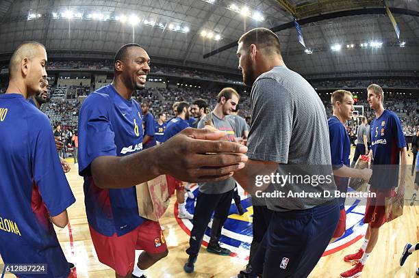 Mitch McGary of the Oklahoma City Thunder shakes hands with Joey Dorsey of FC Barcelona Lassa as part of the 2016 Global Games on October 5, 2016 at...