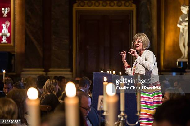 Financial Times wine critic Jancis Robinson talks on a podium about the wines being drunk at Draper's Hall during the Room to Read's Annual Wine Gala...