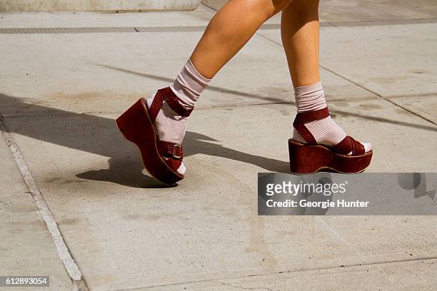 Emma Sousa wearing pastel peach Topshop socks and chunky suede maroon Zara flatform sandals with straps and silver buckles on October 5, 2016 in New...