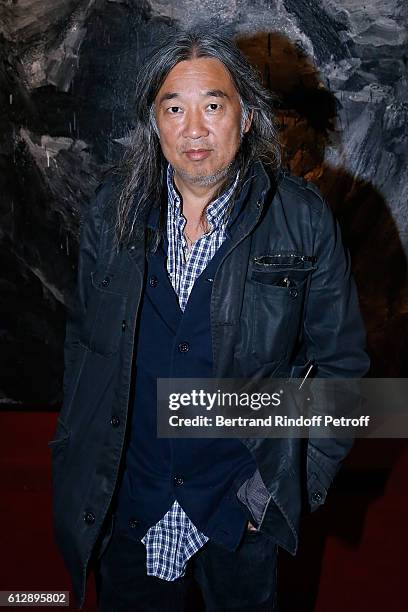 Artist Yan Pei-Ming attends the Coluche Exhibition Opening. This exhibition is organized for the 30 years of the disappearance of Coluche. Held at...