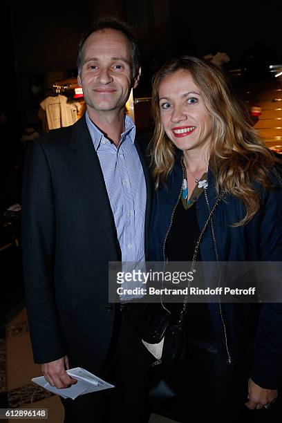 Journalist Fabien Namias and his wife attend the Coluche Exhibition Opening. This exhibition is organized for the 30 years of the disappearance of...