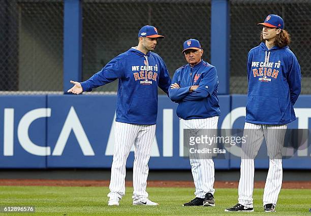 Manager Terry Collins speaks with David Wright of the New York Mets prior to their National League Wild Card game against the San Francisco Giants at...