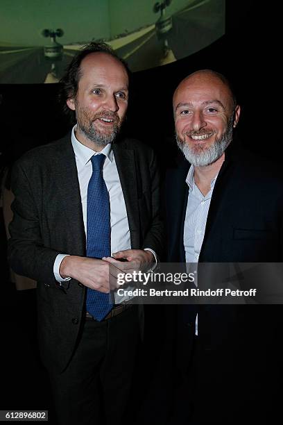 Producer Jean-Marc Dumontet and Communication Director of Lagardere Active, Stephane Berthelot attend the Coluche Exhibition Opening. This exhibition...