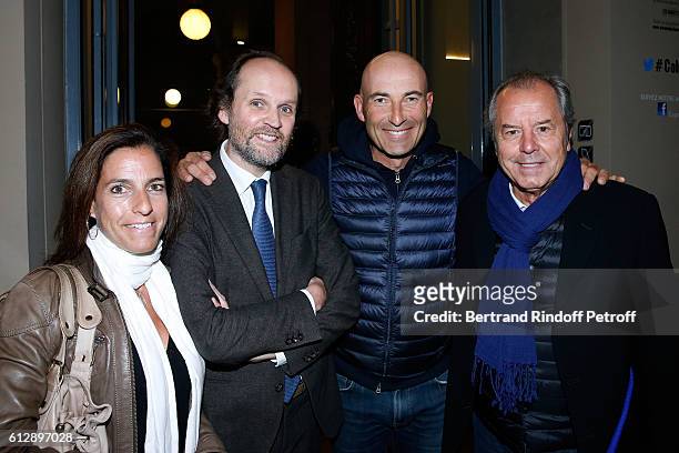 Producer Jean-Marc Dumontet , Nicolas Canteloup , musician Christian Morin and his wife attend the Coluche Exhibition Opening. This exhibition is...