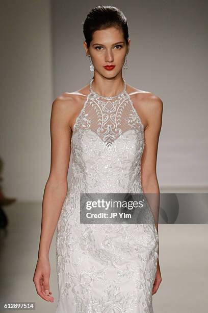 Model walks the runway at the Alfred Angelo Spring 2017 Bridal Show with Disney Weddings at EZ Studios on October 5, 2016 in New York City.