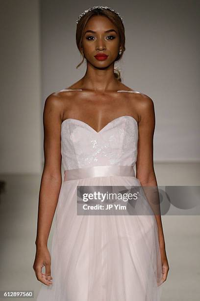 Model walks the runway at the Alfred Angelo Spring 2017 Bridal Show with Disney Weddings at EZ Studios on October 5, 2016 in New York City.