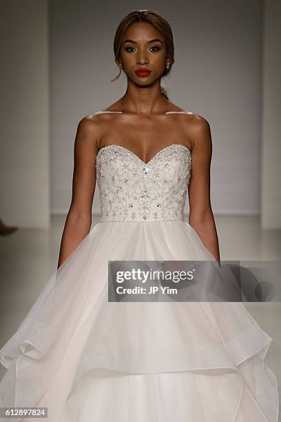 Model walks the runway at the Alfred Angelo Spring 2017 Bridal Show with Disney Weddings at EZ Studios on October 5, 2016 in New York City.