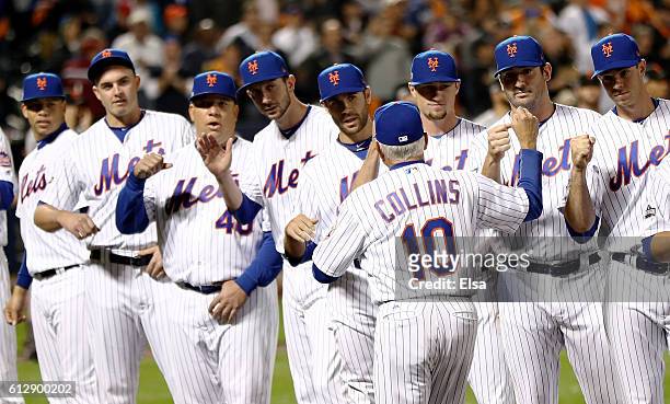 Terry Collins of the New York Mets greets his team prior to their National League Wild Card game against the San Francisco Giants at Citi Field on...