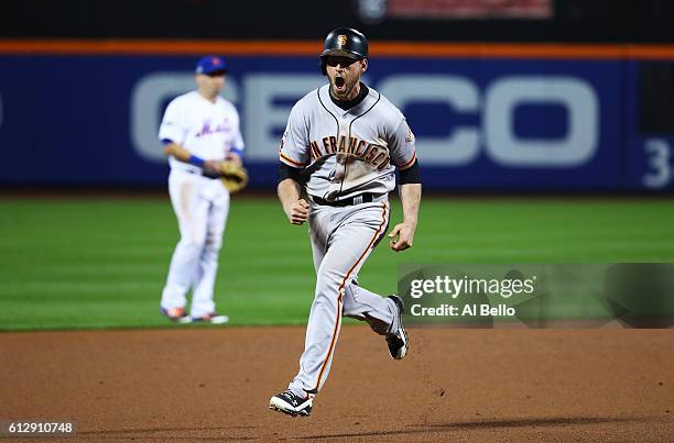 Conor Gillaspie of the San Francisco Giants runs the bases as he celebrates his three-run homerun in the ninth inning against the New York Mets...