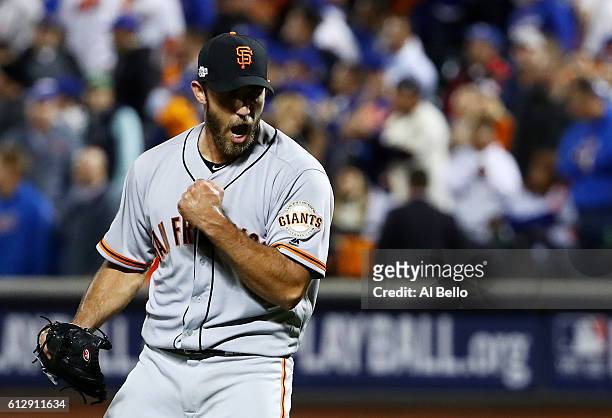 Madison Bumgarner of the San Francisco Giants celebrates their 3-0 win over the New York Mets during their National League Wild Card game at Citi...