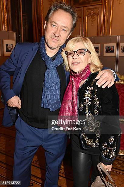 Jean Christophe Molinier and Nicoletta attend the Massimo Gargia's Photos of Celebrities Exhibition at Mairie du 8eme - Paris Fashion Week Womenswear...
