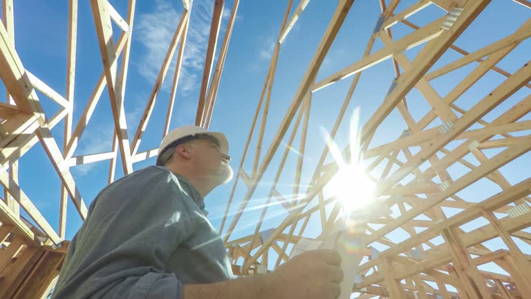 https://media.gettyimages.com/id/612922266/video/construction-worker-on-site-with-building-plans.jpg?b=1&s=640x640&k=20&c=DqnqQePctHAjjak6KcK74QpYkiqz_aPp9_AsL0jqos8=