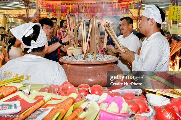 Members of a Malaysian ethnic Chinese community perform a prayer during the Nine Emperor Gods Festival on October 02, 2016 at a Nine Emperor Gods...