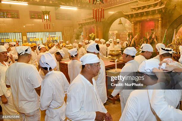 Members of a Malaysian ethnic Chinese community perform a prayer during the Nine Emperor Gods Festival on October 02, 2016 at a Nine Emperor Gods...