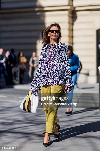 Viviana Volpicella outside Miu Miu on October 5, 2016 in Paris, France.