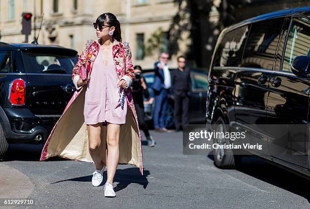 Leaf Greener wearing a pink dress outside Miu Miu on October 5, 2016 in Paris, France.