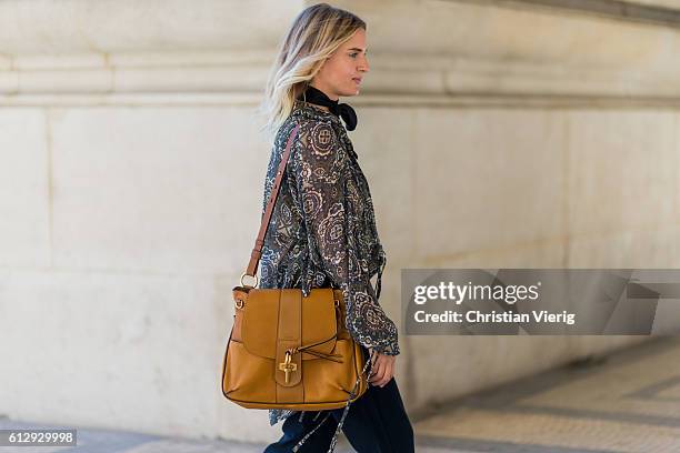 Mirjam Flatau wearing a blouse and Chloe Lexa bag outside on October 5, 2016 in Paris, France.