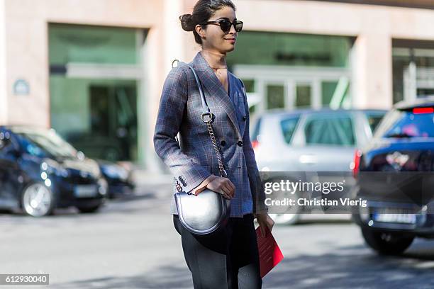 Caroline Issa outside Moncler Gamme Rouge on October 5, 2016 in Paris, France.