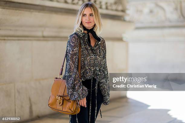 Mirjam Flatau wearing a blouse and Chloe Lexa bag outside on October 5, 2016 in Paris, France.