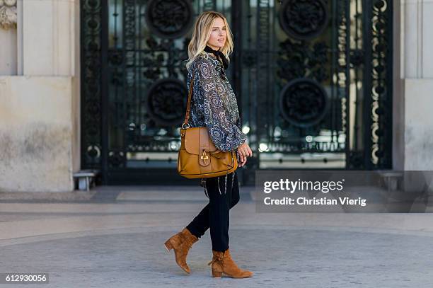 Mirjam Flatau wearing a blouse and Chloe Lexa bag outside on October 5, 2016 in Paris, France.