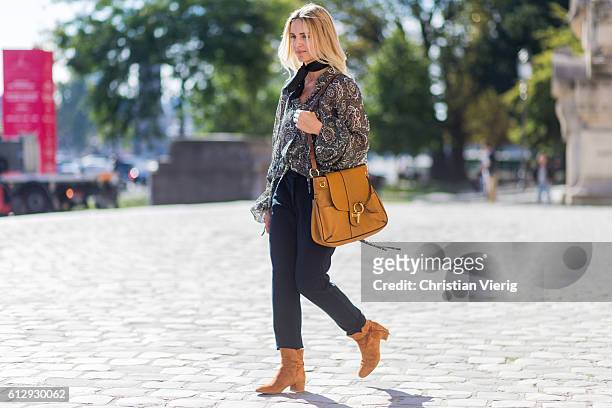Mirjam Flatau wearing a blouse and Chloe Lexa bag outside on October 5, 2016 in Paris, France.