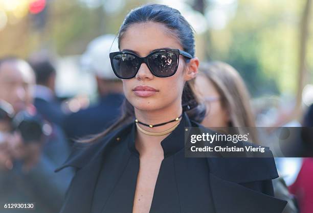 Model Sara Sampaio outside Miu Miu on October 5, 2016 in Paris, France.