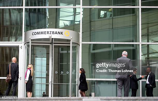 People stand in front of entrance of the corporate headquarters of Commerzbank on October 5, 2016 in Frankfurt, Germany. Banks across Europe are...