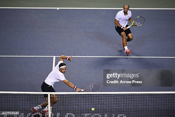 Juan Sebastian Cabal of Colombia and Robert Farah of Colombia in action during the men's doubles quarterfinals match against Jamie Murray of Great...