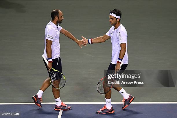 Juan Sebastian Cabal of Colombia and Robert Farah of Colombia react during the men's doubles quarterfinals match against Jamie Murray of Great...