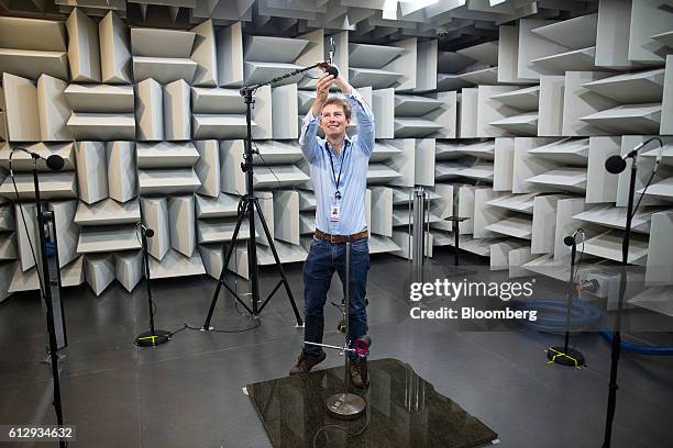 An employee adjusts a microphone as he prepares to test the acoustics of a Dyson Supersonic hair dryer inside the semi-anechoic chamber at the Dyson...