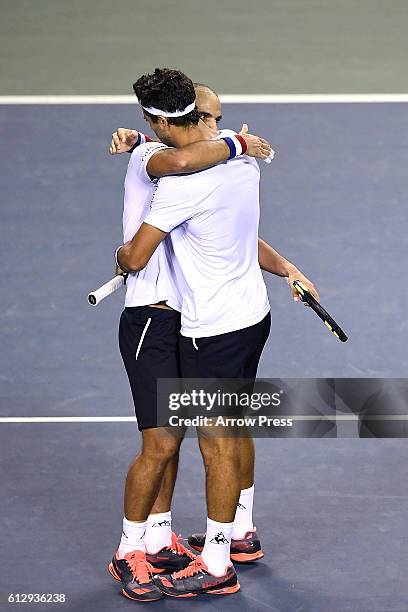 Juan Sebastian Cabal of Colombia and Robert Farah of Colombia react after winning the men's doubles quarterfinals match against Jamie Murray of Great...