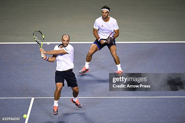 Juan Sebastian Cabal of Colombia and Robert Farah of Colombia in action during the men's doubles quarterfinals match against Jamie Murray of Great...