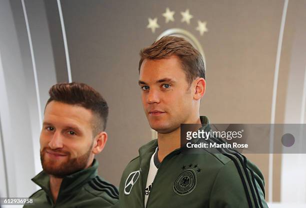 Manuel Neuer and Shkodran Mustafi of Germany leave the press conference at Mercedes Autohaus on October 6, 2016 in Hamburg, Germany.