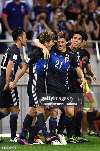 Genki Haraguchi and Gotoku Sakai of Japan celebrate after making their first goal during the 2018 FIFA World Cup Qualifiers match between Japan and...