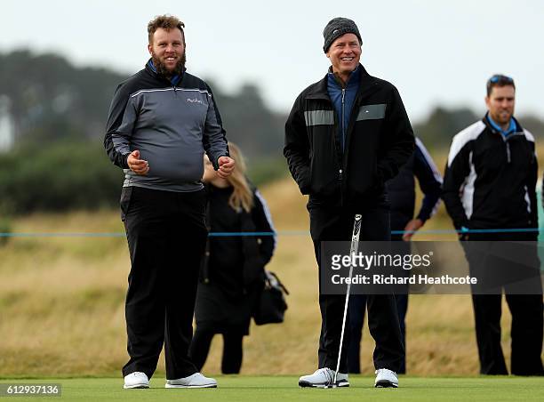Actor Greg Kinnear and Andrew Johnson of England on the 16th tee during the first round of the Alfred Dunhill Links Championship on the Championship...