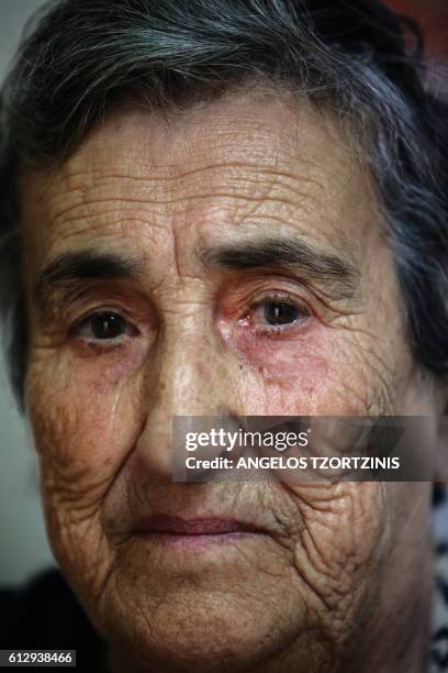 Emilia Kamvisi a Nobel Peace Prize nominee, poses inside her house at the Skala Sikamias village on the island of Lesbos on October 5, 2016. This...