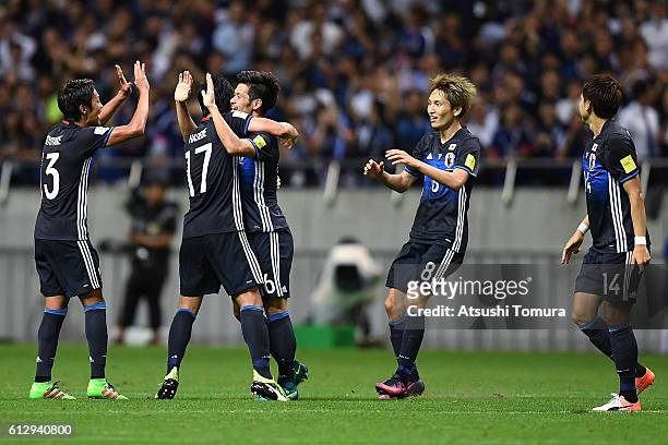 Hotaru Yamaguchi of Japan celebrates with his team mates after scoring their second goal during the 2018 FIFA World Cup Qualifiers match between...