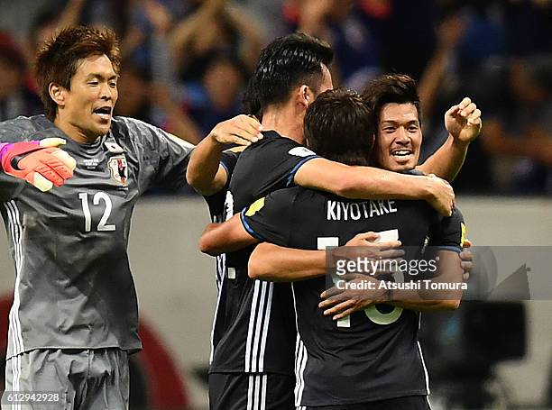 Hotaru Yamaguchi celebrates with his team after winning the 2018 FIFA World Cup Qualifiers match between Japan and Iraq at Saitama Stadium on October...