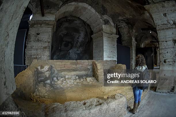 Woman looks at a reconstitution of the Archive Room of Ebla, as part of an exhibition called "Rising from Destruction Ebla, Nimrod, Palmyra"...