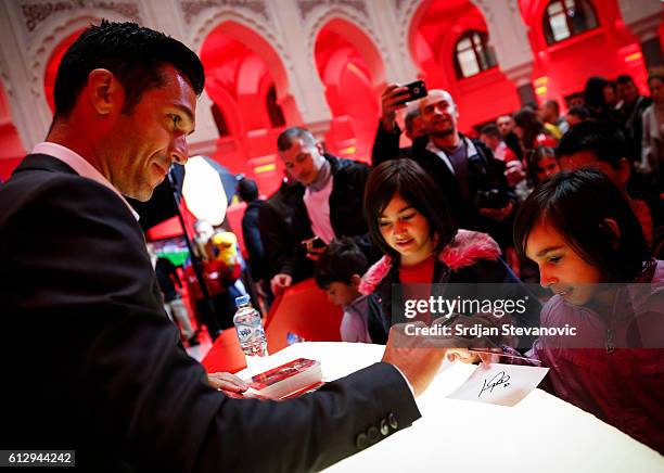 Luis Garcia signs autographs during the UEFA Champions League Trophy Tour - by UniCredit at City Hall on October 6, 2016 in Sarajevo, Bosnia and...