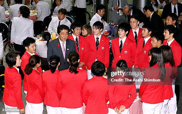 Japanese Prime Minister Shinzo Abe talks with the Japanese Rio 2016 athletes includin Kenzo Shirai and Kohei Uchimura at the Rio 2016 Afterparty at...