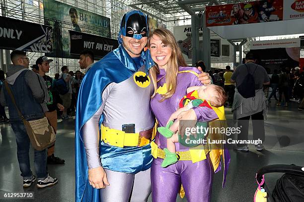 Cosplayers Jon Greer, Ashley Greer and son Grayson Greer dressed as Batman, Batgirl and Robin attend 2016 New York Comic Con - Day 1 on October 6,...