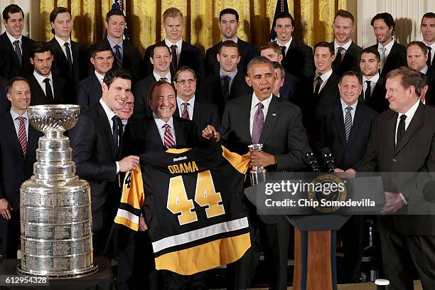 President Barack Obama poses for photographs with the National Hockey League champion Pittsburgh Penguins, including Sidney Crosby, owner Ronald...