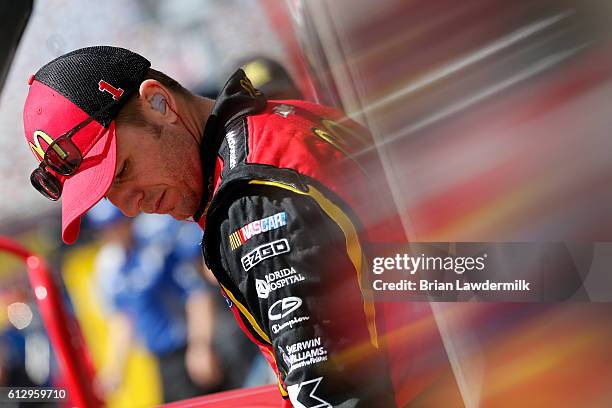 Jamie McMurray, driver of the McDonald's Chevrolet, stands in the garage area during practice for the NASCAR Sprint Cup Series Bank of America 500 at...