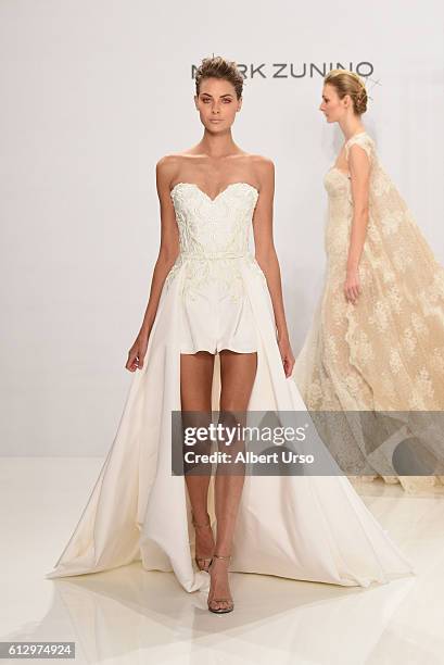 Model walks the runway at the Mark Zunino For Kleinfeld show during New York Fashion Week: Bridal at Kleinfeld on October 6, 2016 in New York City.